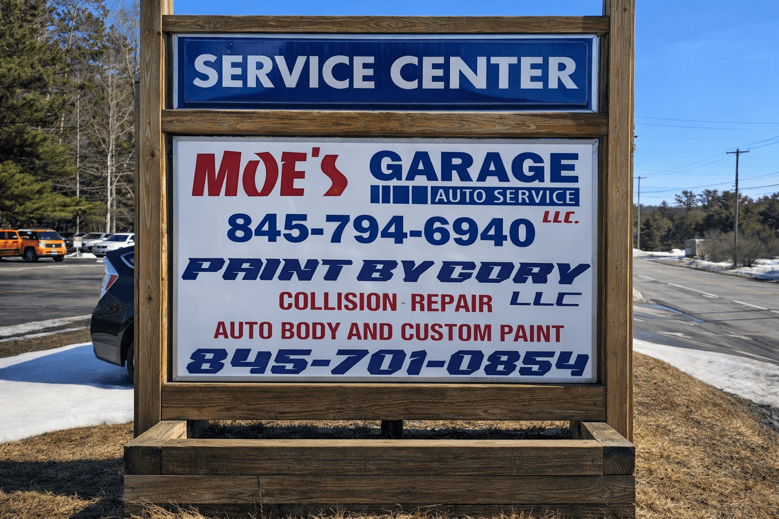 Moe's Garage - main service bay with vehicle on lift
