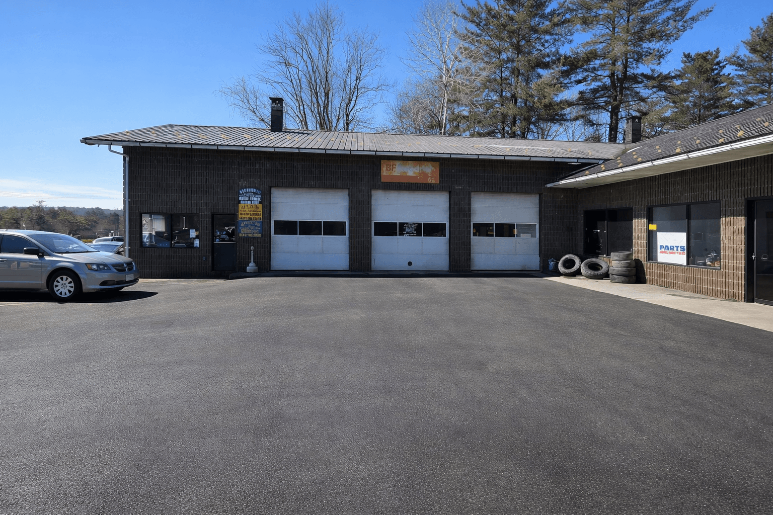 Moe's Garage - exterior building with 3 bay doors